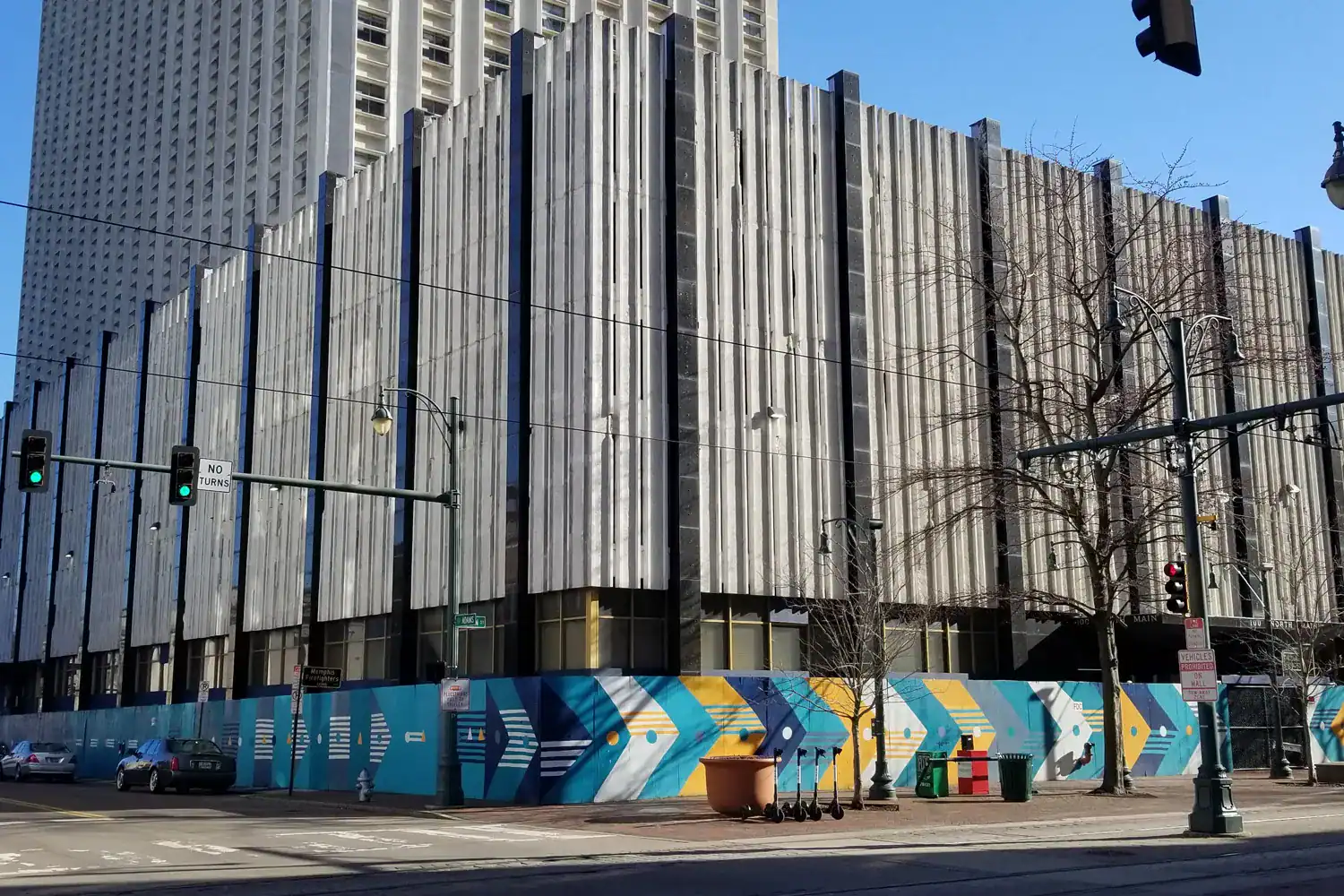 aiafuture-web-1500×1000-1 Modern downtown building with distinctive vertical metal facade in Memphis Tennessee.